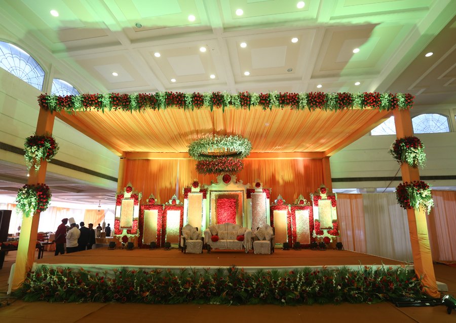 Grand wedding stage with artwork and flower-work